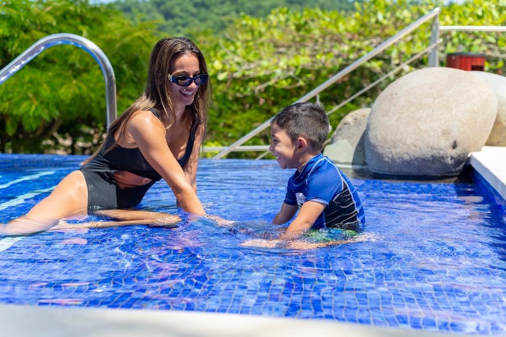 Family enjoying the pool at Los Sueños Resort Costa Rica