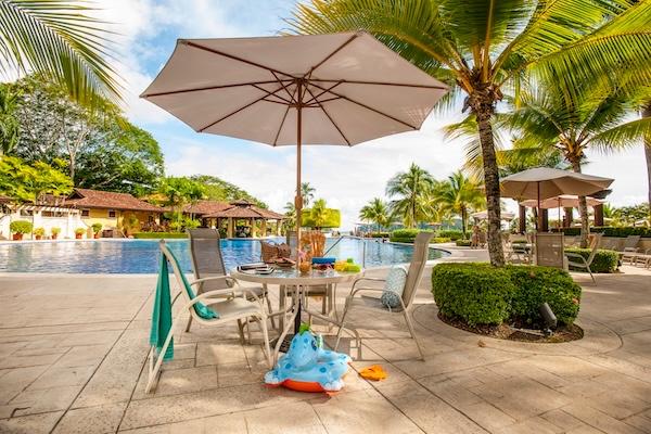 Family enjoying the Beach Club at Los Sueños Resort Costa Rica